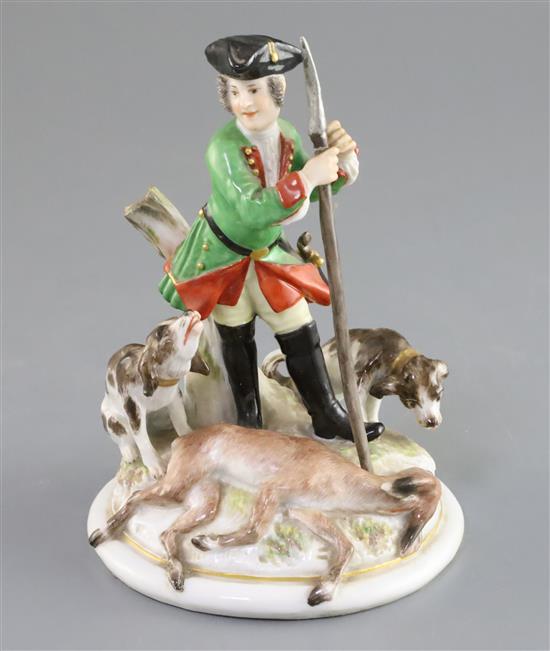 A Meissen group of a huntsman with hounds and prey, 19th century, H. 15.5cm, spear tip restored